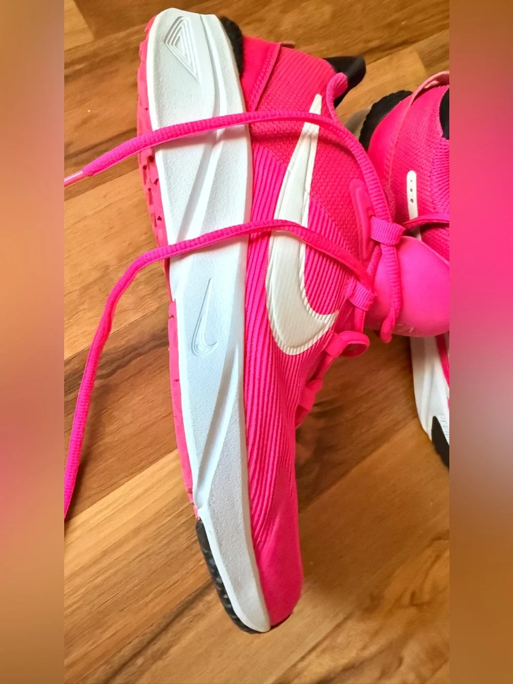 Nike Vibrant Pink Running Shoe with White Swoosh
